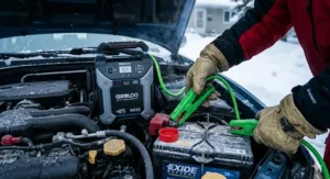 Connecting portable jump starter -40C rated clamps to a frozen car battery.