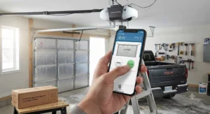 Close-up of a homeowner using a smartphone app to remotely close their smart garage door opener